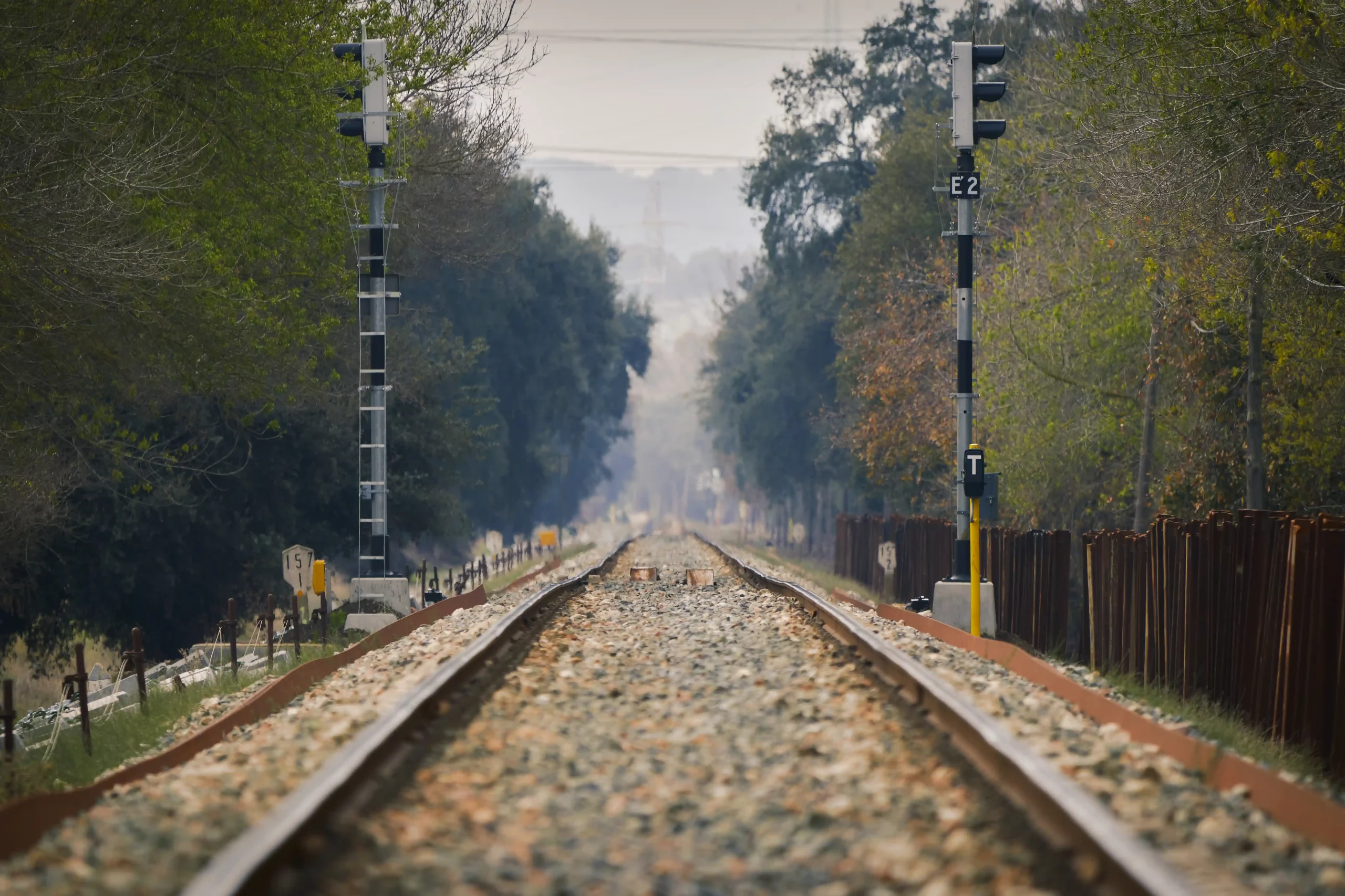 1 closeup-train-rails-wooden-fence-right